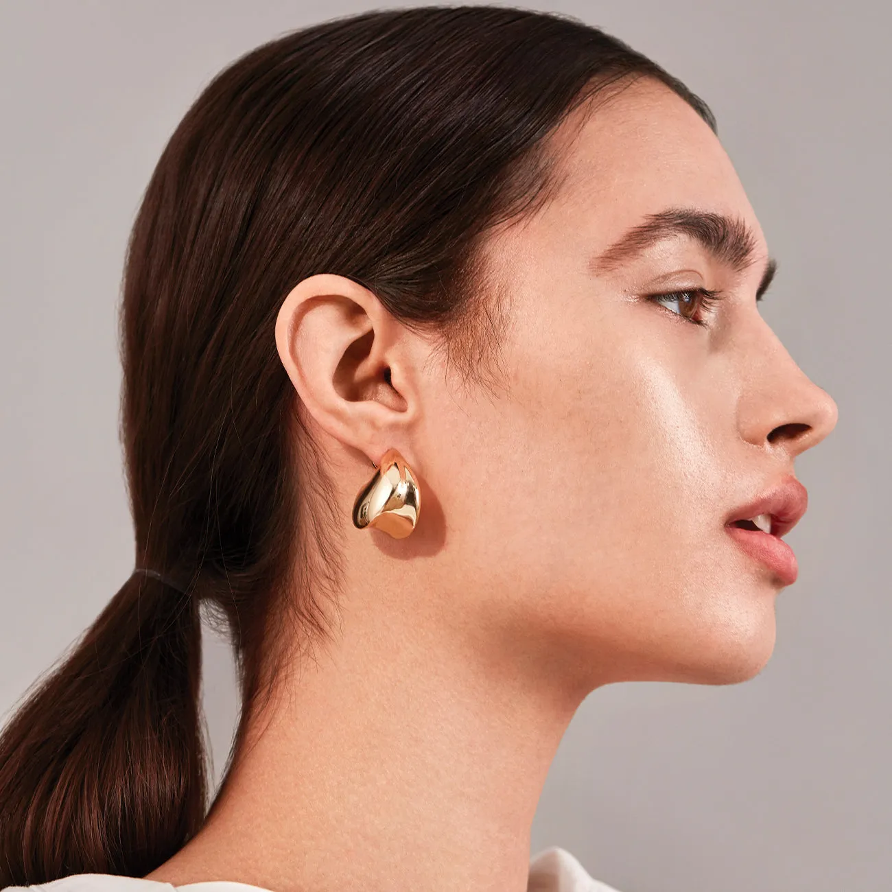 Hailey Bieber in Gold Puff Earrings